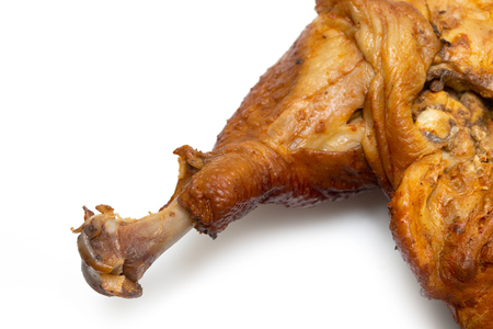 smoked chicken leg isolated on white backgroundの写真素材
