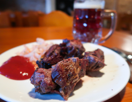 fried meat slices and beerの写真素材