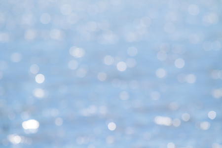 the sun shines on the waterの写真素材