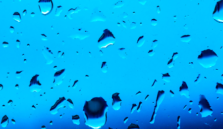 drops of water on a blue background. macro