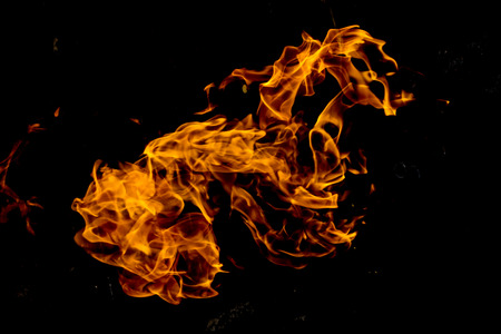 Fire flames on a black backgroundの写真素材