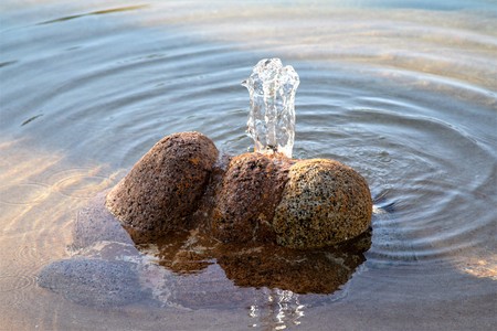 stone in water with a fountainの写真素材