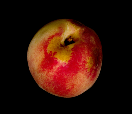 peaches isolated on a black backgroundの写真素材