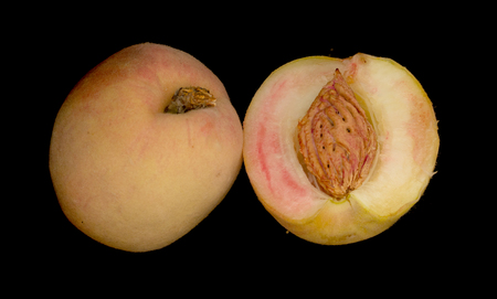 peaches isolated on a black backgroundの写真素材