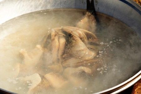 metal cauldron on fire cook on the streetの写真素材