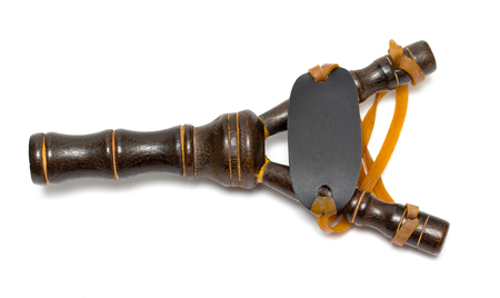 Wooden slingshot isolated on white background. Shot classic traditional outdoor toys. Kids boys.