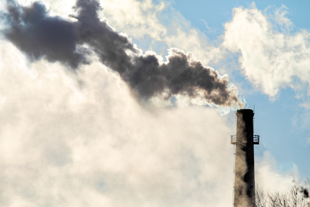 smoke from the chimney sky winterの写真素材