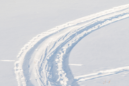 footprints on white snow winterの写真素材