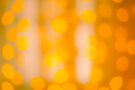 blurred yellow bokeh as backgroundの写真素材