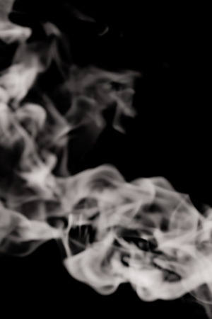 white smoke flame on a black backgroundの写真素材