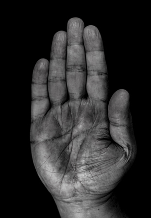 male hands and fingers close up on black backgroundの写真素材