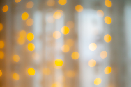 blurred yellow bokeh as backgroundの写真素材