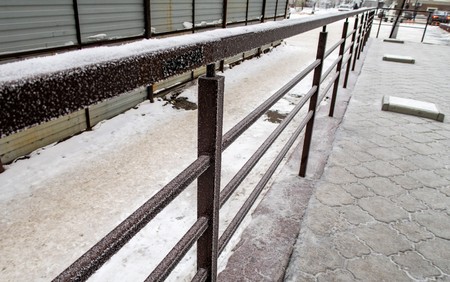 metal fence winter snowの写真素材