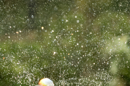 defocused, splashing water, blurred drops bokeh natureの写真素材