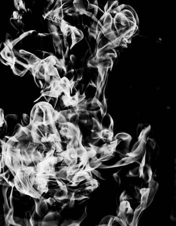 white smoke flame on a black backgroundの写真素材