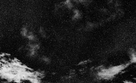 snow, stars, white dots bokeh on black backgroundの写真素材