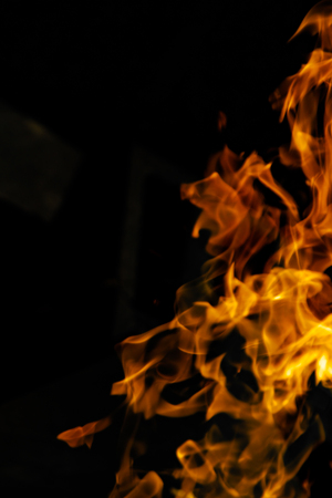 Fire flames on a black backgroundの写真素材