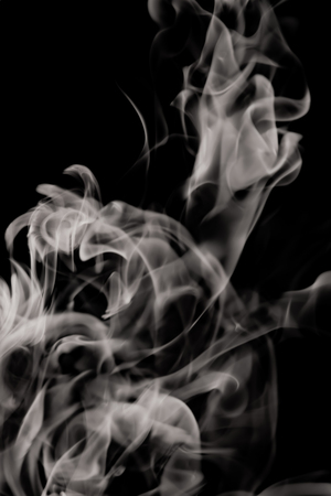 white smoke flame on a black backgroundの写真素材