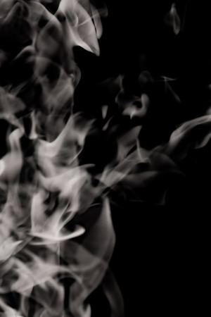 white smoke flame on a black backgroundの写真素材