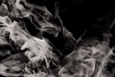white smoke flame on a black backgroundの写真素材