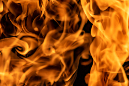 Fire flames on a black backgroundの写真素材