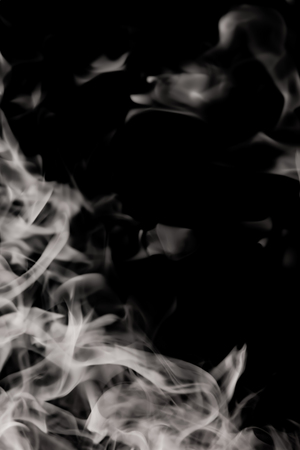 white smoke flame on a black backgroundの写真素材