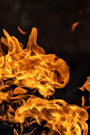 Fire flames on black background, abstract blaze.