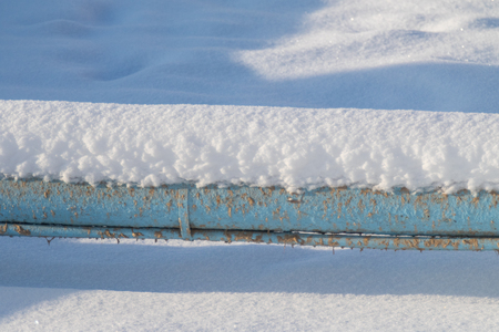 metal pipe in the snow winterの写真素材