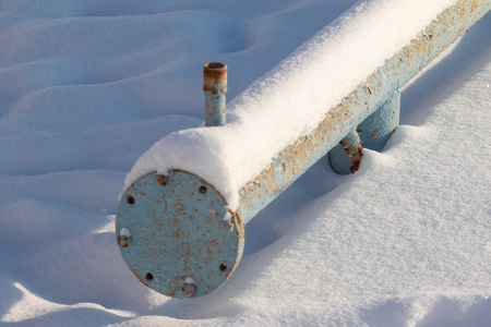 metal pipe in the snow winterの写真素材