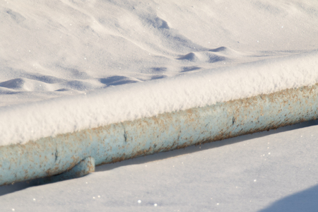metal pipe in the snow winterの写真素材