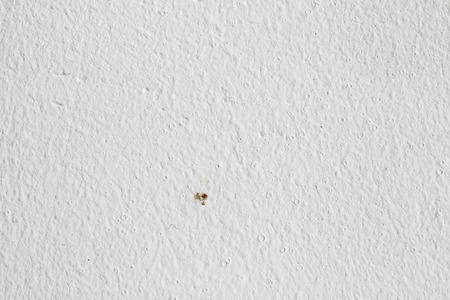 Background texture.White concrete wall. Small cracks on the surface.の写真素材