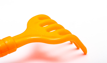 plastic rake on white backgroundの写真素材