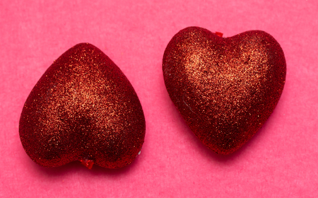 Red heart on a pink background. St. Valentine's Day Beautiful background from hearts. Concept of love and romance. Love background.の写真素材