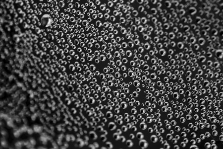 Air bubbles in the water on a black backgroundの写真素材