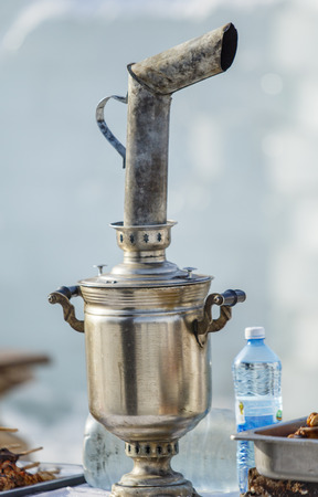 Metal samovar on the street in winter.の写真素材