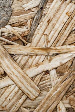 Wood panel made from wood chips texture background.