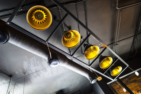 Old lamps chandeliers production on the ceiling.の写真素材