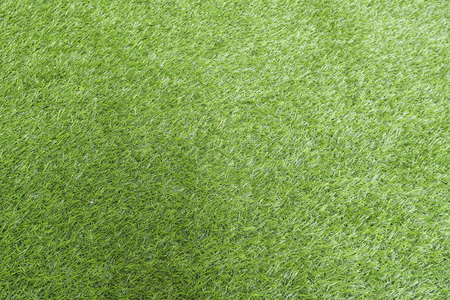 Texture of green grass, field with artificial turf for football, background.の写真素材