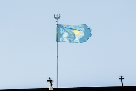 Flag of Kazakhstan against the blue sky.の写真素材