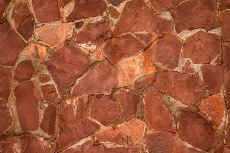 The texture of the stone. Brown stone wall background.
