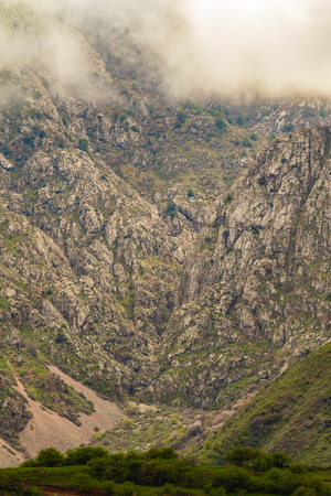Mountains cliffs fog clouds nature summer.の写真素材