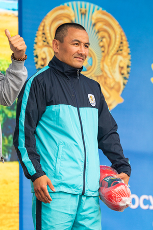 Petropavlovsk, Kazakhstan - June 4, 2019: Day of state symbols of the Republic of Kazakhstan. Holiday children and adults celebrate. Athletes and musicians in the park in the park.のeditorial素材