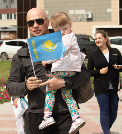Petropavlovsk, Kazakhstan - June 4, 2019: Day of state symbols of the Republic of Kazakhstan. Holiday children and adults celebrate. Athletes and musicians in the park in the park.のeditorial素材