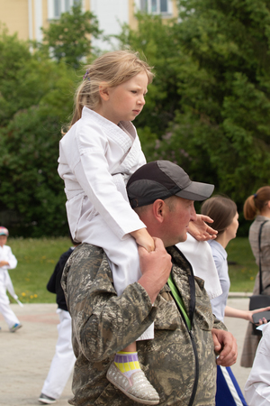 Petropavlovsk, Kazakhstan - June 4, 2019: Day of state symbols of the Republic of Kazakhstan. Holiday children and adults celebrate. Athletes and musicians in the park in the park.のeditorial素材