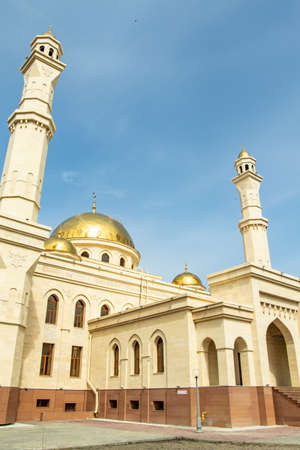 Petropavlovsk, Kazakhstan - May 6, 2019: Muslim mosque, golden domes.の写真素材