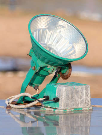 Spotlight lamp on the ground to illuminate the building, green high power lamp.の写真素材