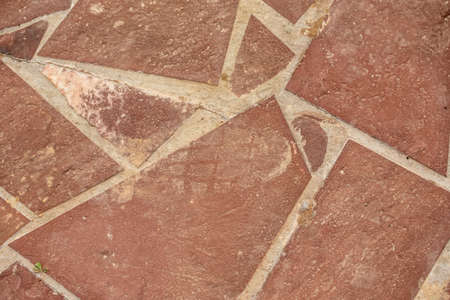 Red granite stone wall as background