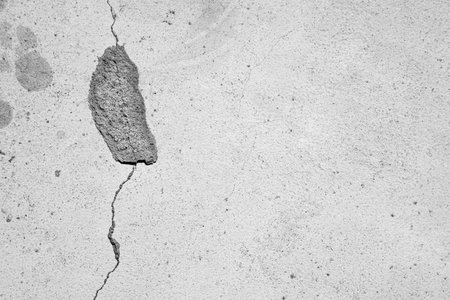 light concrete old cracked wall backgroundの写真素材