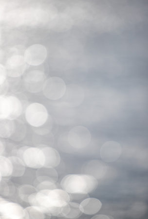 out of focus bokeh background on waterの写真素材
