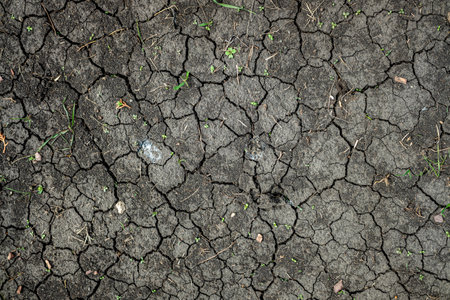 black cracked earth from the scorching sunの写真素材